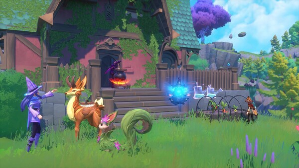 Witchspire witches and familiars gathered beside a magical base